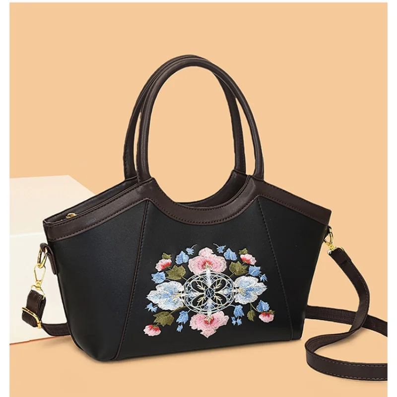 Elegant embroidered tote bag with top handle & detachable strap, multi-way carry design for everyday use
Elegant embroidered tote bag with top handle & detachable strap, multi-way carry design for everyday use