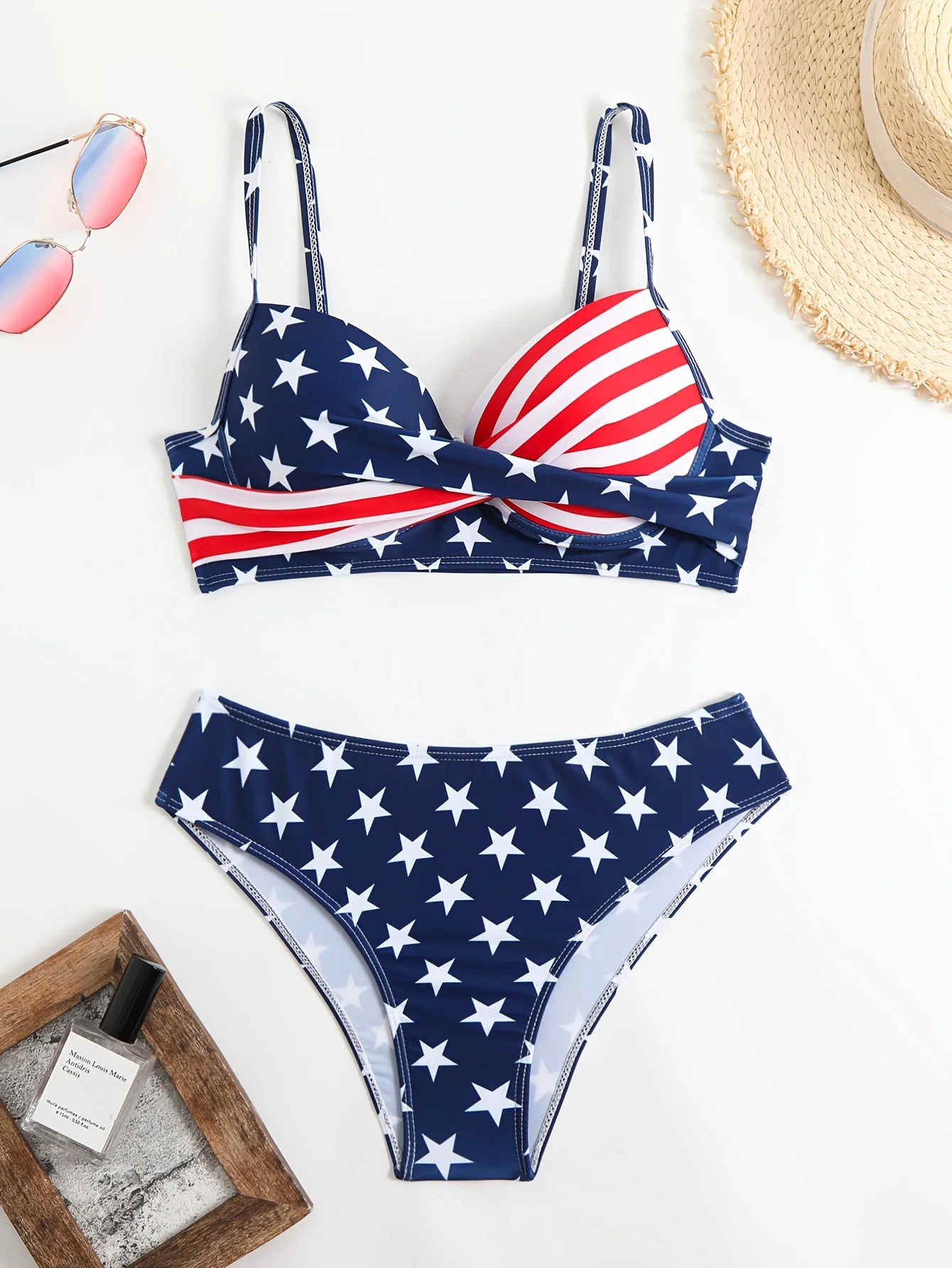 A two-piece bikini with a national flag theme, featuring an Independence Day celebration. The top has a twisted, gathered design, while the bottom is a high-waisted triangle style with thin straps. Perfect for vacation pool and beach swimming.
A two-piece bikini with a national flag theme, featuring an Independence Day celebration. The top has a twisted, gathered design, while the bottom is a high-waisted triangle style with thin straps. Perfect for vacation pool and beach swimming.