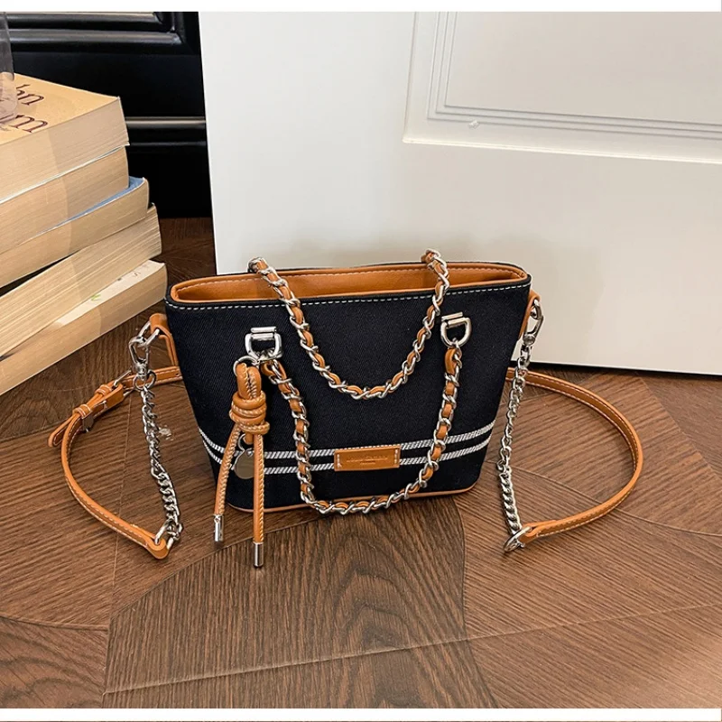 Mini bucket bag with dual chain straps & decorative charm, multi-way carry design for everyday use
Mini bucket bag with dual chain straps & decorative charm, multi-way carry design for everyday use