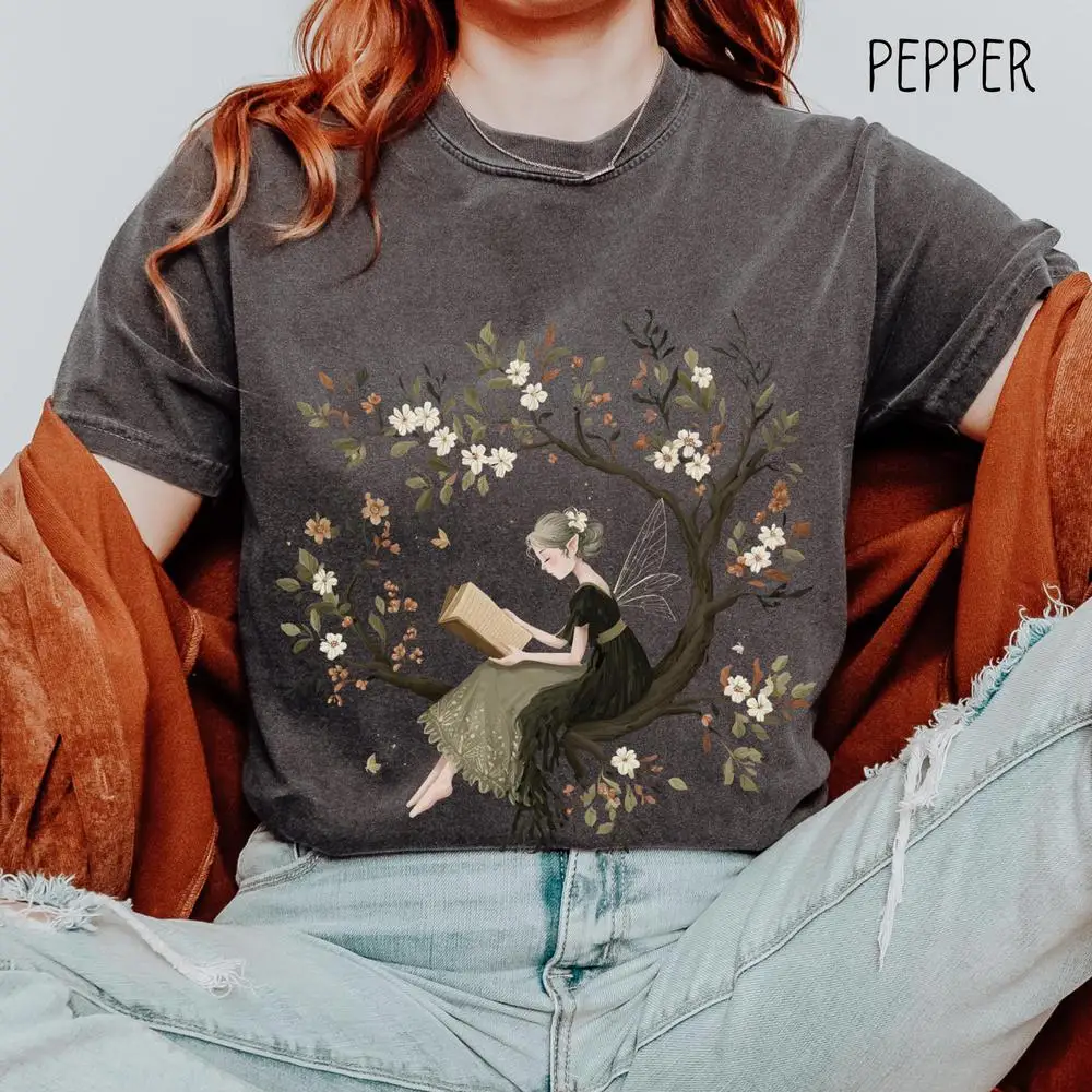 Women Cotton T Shirt Fairy Reading Book in Tree Shirt Whimsical Nature Tee Fairycore Top Short Sleeve Fashion Crop Tops
Women Cotton T Shirt Fairy Reading Book in Tree Shirt Whimsical Nature Tee Fairycore Top Short Sleeve Fashion Crop Tops