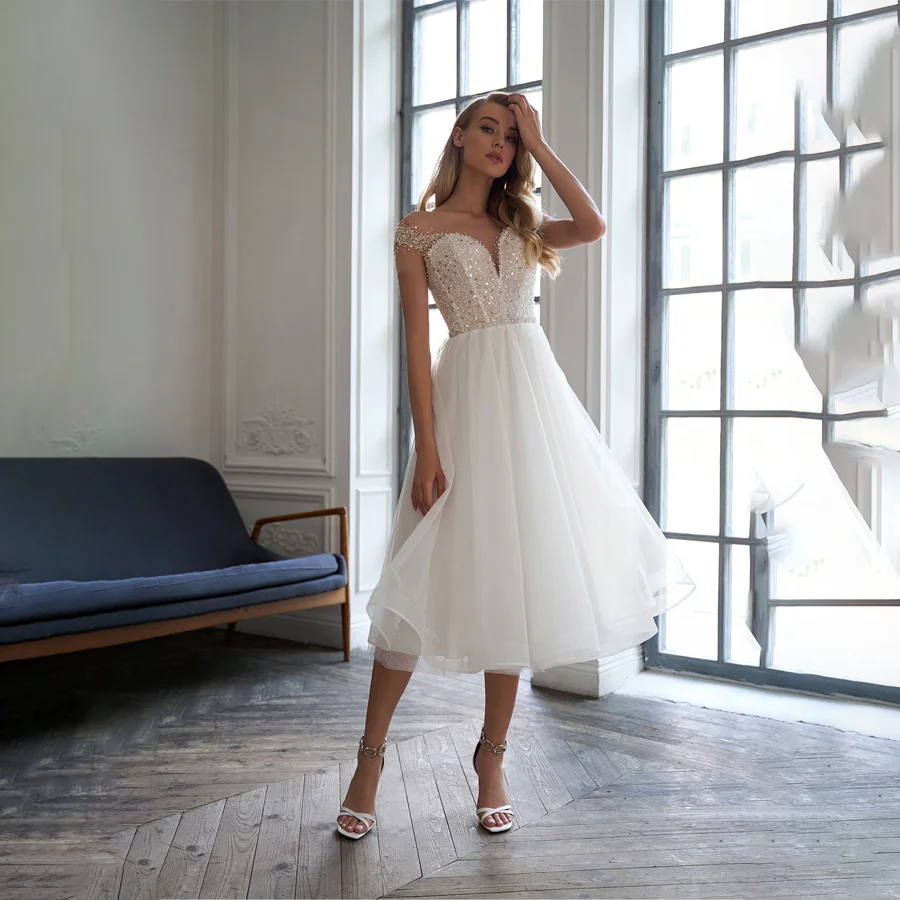 Charming Tea-Length Wedding Dress for Women Short Sparkling Sequin Beaded Bridal Gown with V-Neckline
Charming Tea-Length Wedding Dress for Women Short Sparkling Sequin Beaded Bridal Gown with V-Neckline