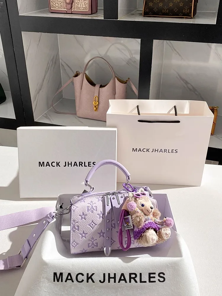 Luxury and Fashion Handheld Boston Bag with Cute Doll Pendant and Letter Printing Women Charming and Chic Shoulder Handbag
Luxury and Fashion Handheld Boston Bag with Cute Doll Pendant and Letter Printing Women Charming and Chic Shoulder Handbag