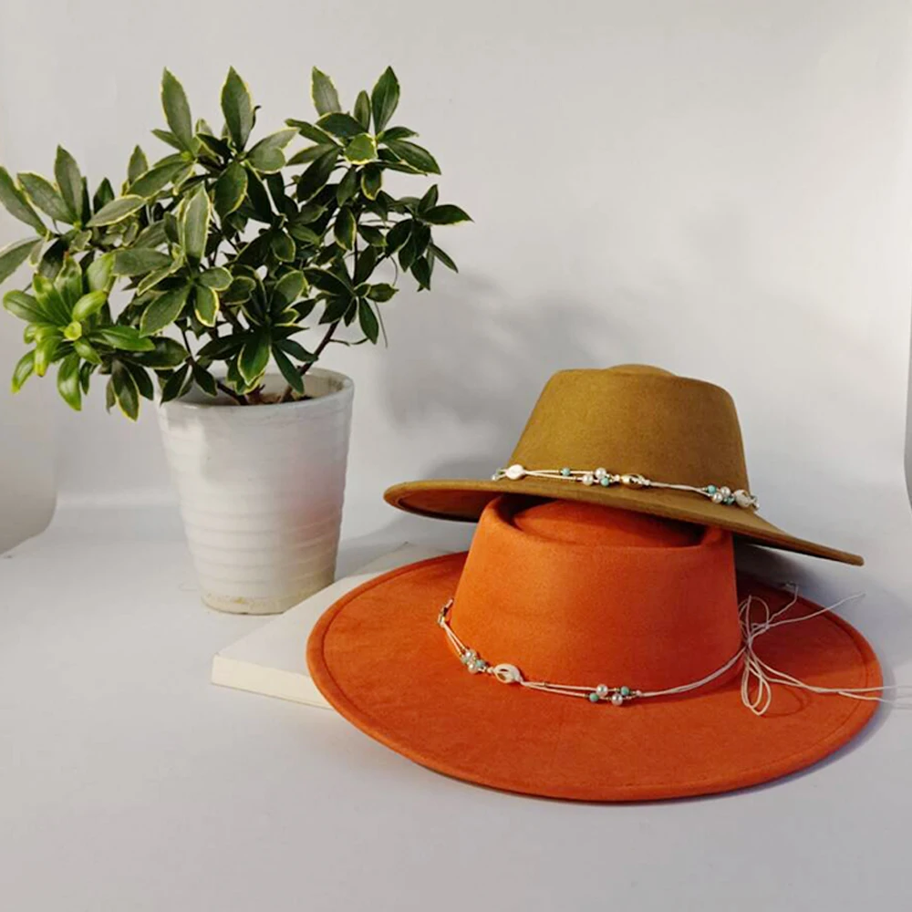 Women's suede wide-brimmed fedora hat, Western cowboy style, paired with a shell-decorated jazz hat, equestrian party hat.
Women's suede wide-brimmed fedora hat, Western cowboy style, paired with a shell-decorated jazz hat, equestrian party hat.