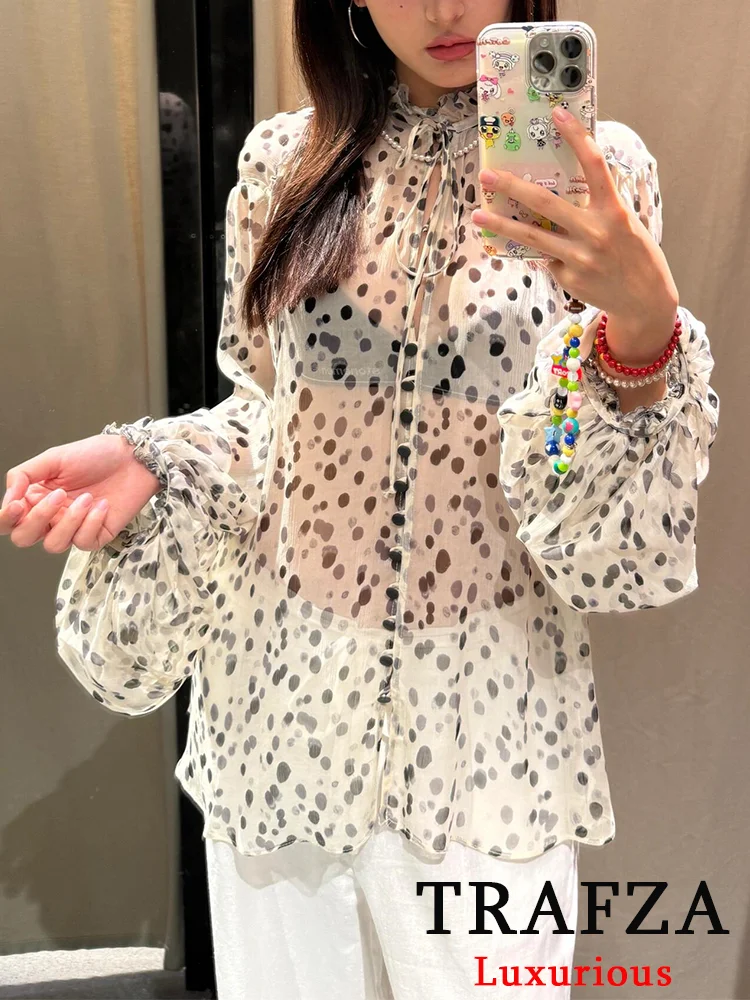 TRAFZA Elegant Chic Women Blouse Polka Dot Lace-up V-Neck Puff Sleeve Ruffles Shirts Fashion 2025 Spring Summer Casual Blouses
TRAFZA Elegant Chic Women Blouse Polka Dot Lace-up V-Neck Puff Sleeve Ruffles Shirts Fashion 2025 Spring Summer Casual Blouses