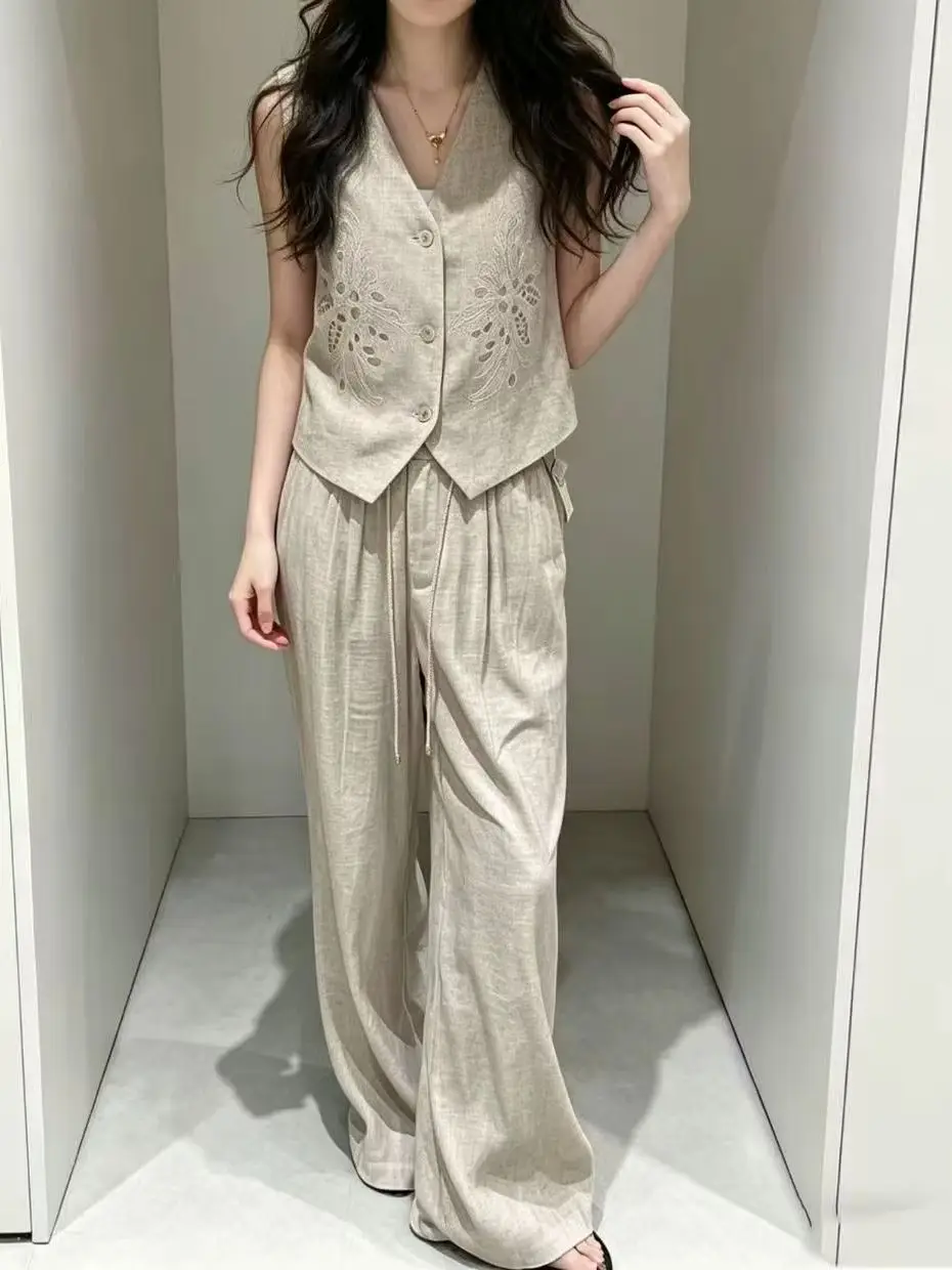 Elegant linen embroidered sleeveless vest and elastic waist wide leg trouser suit
Elegant linen embroidered sleeveless vest and elastic waist wide leg trouser suit