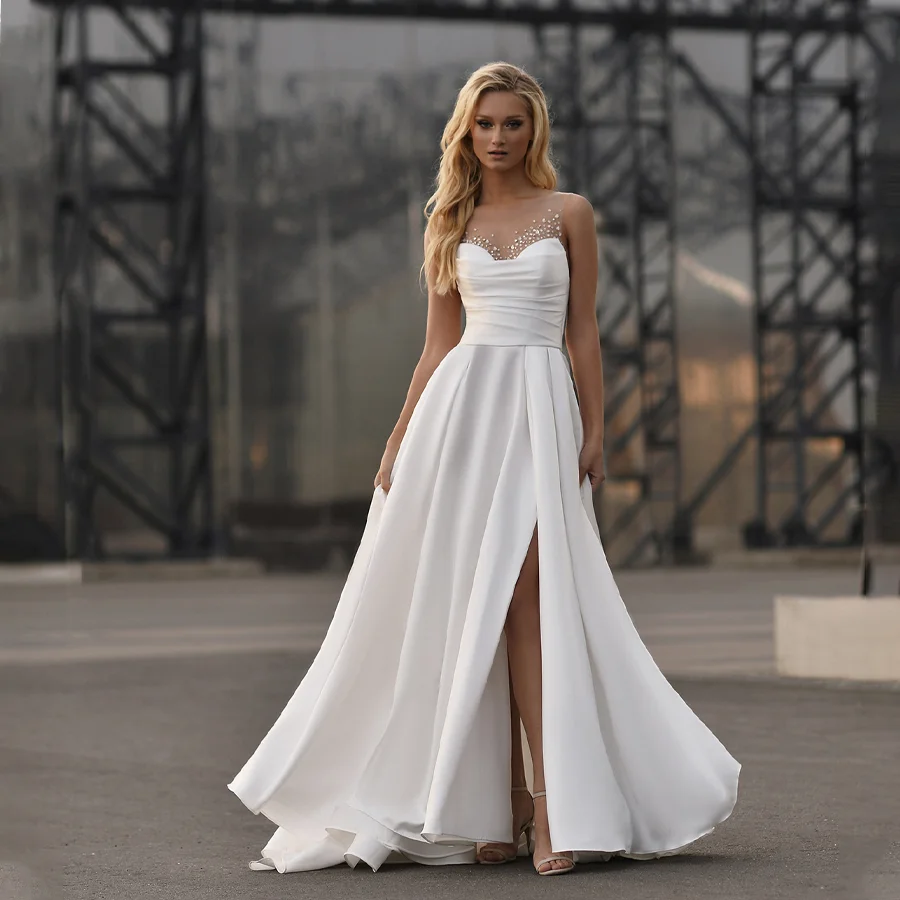 Exquisite Pleated Satin Wedding Dress with Illusion Button Back Sparkling Sequin Bridal Gown with High-Split Design for Women
Exquisite Pleated Satin Wedding Dress with Illusion Button Back Sparkling Sequin Bridal Gown with High-Split Design for Women