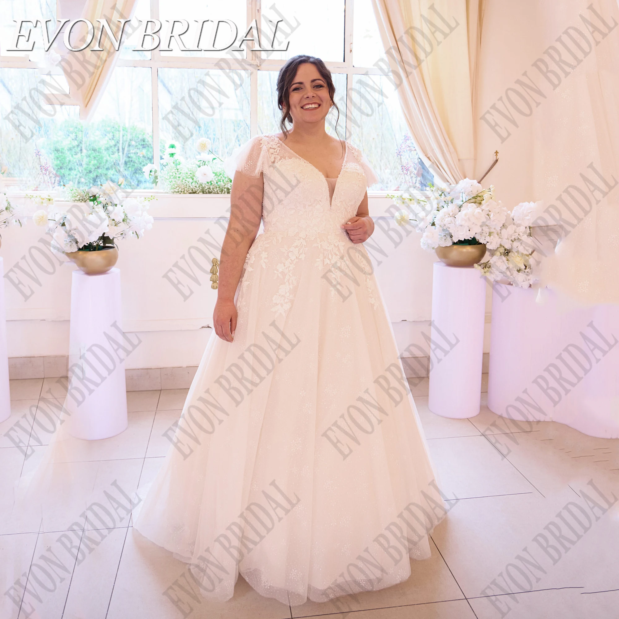 EVON BRIDAL Glitter A-Line Tulle Wedding Dress Plus Size Flare Sleeve Applique Bride Gowns Beading Wedding Gown Women Customized
EVON BRIDAL Glitter A-Line Tulle Wedding Dress Plus Size Flare Sleeve Applique Bride Gowns Beading Wedding Gown Women Customized