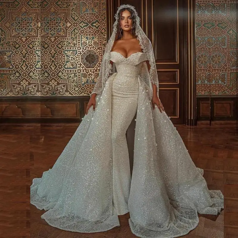 Sequin Mermaid Castle Wedding Dresses Off the Shoulder Detachable Train Pearls Bridal Gowns Arabic Dubai Vestidos De Noiva
Sequin Mermaid Castle Wedding Dresses Off the Shoulder Detachable Train Pearls Bridal Gowns Arabic Dubai Vestidos De Noiva