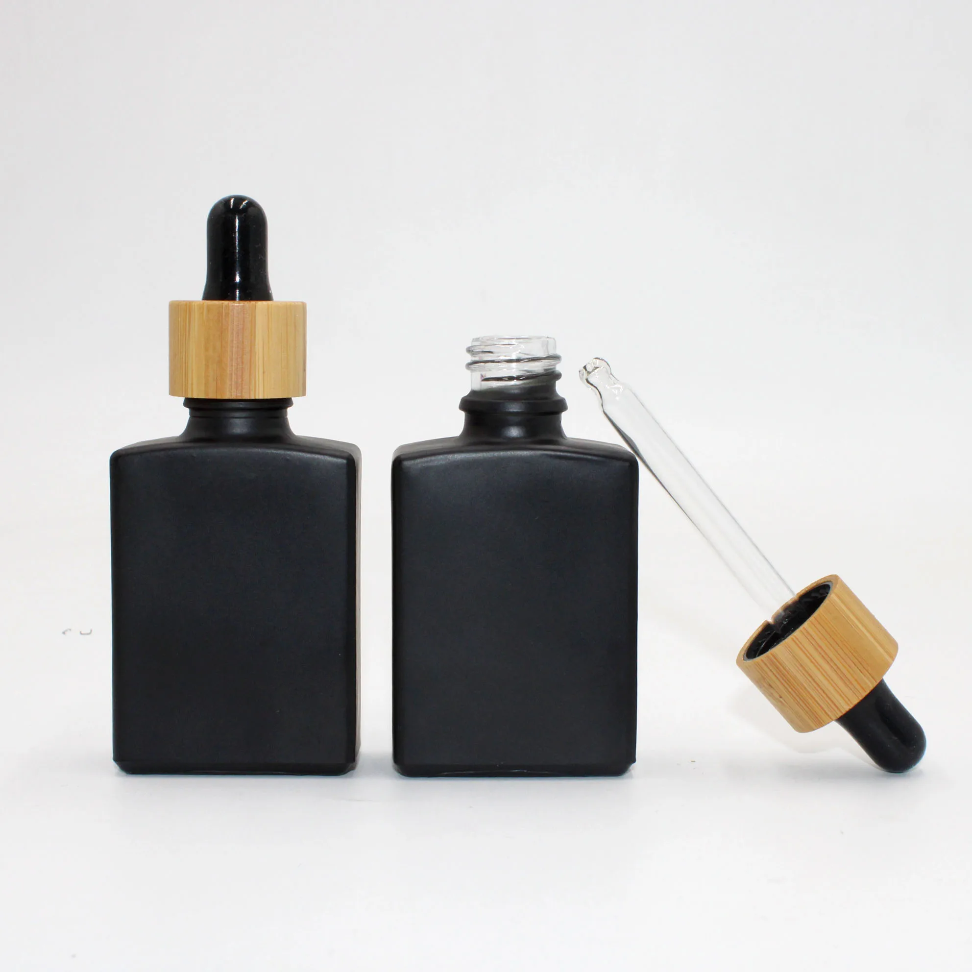 30ml Square Dropper Bottle Mini Perfume Bottle Liquid Packaging Container Bamboo Lid Cosmetic Container
30ml Square Dropper Bottle Mini Perfume Bottle Liquid Packaging Container Bamboo Lid Cosmetic Container
