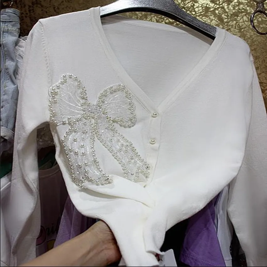 Heavy industry beaded pearl fairy sequins knitted cardigan women v-neck three-dimensional big bow top outwear
Heavy industry beaded pearl fairy sequins knitted cardigan women v-neck three-dimensional big bow top outwear