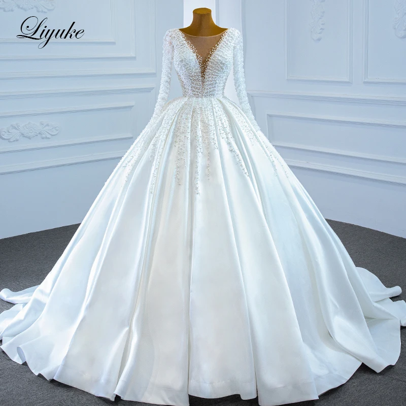 Liyuke Exquisite Luxury Pearls Long Sleeve Ball Gown Wedding Dress With Deep V Neck Beads Satin Skirt Bridal Gown
Liyuke Exquisite Luxury Pearls Long Sleeve Ball Gown Wedding Dress With Deep V Neck Beads Satin Skirt Bridal Gown