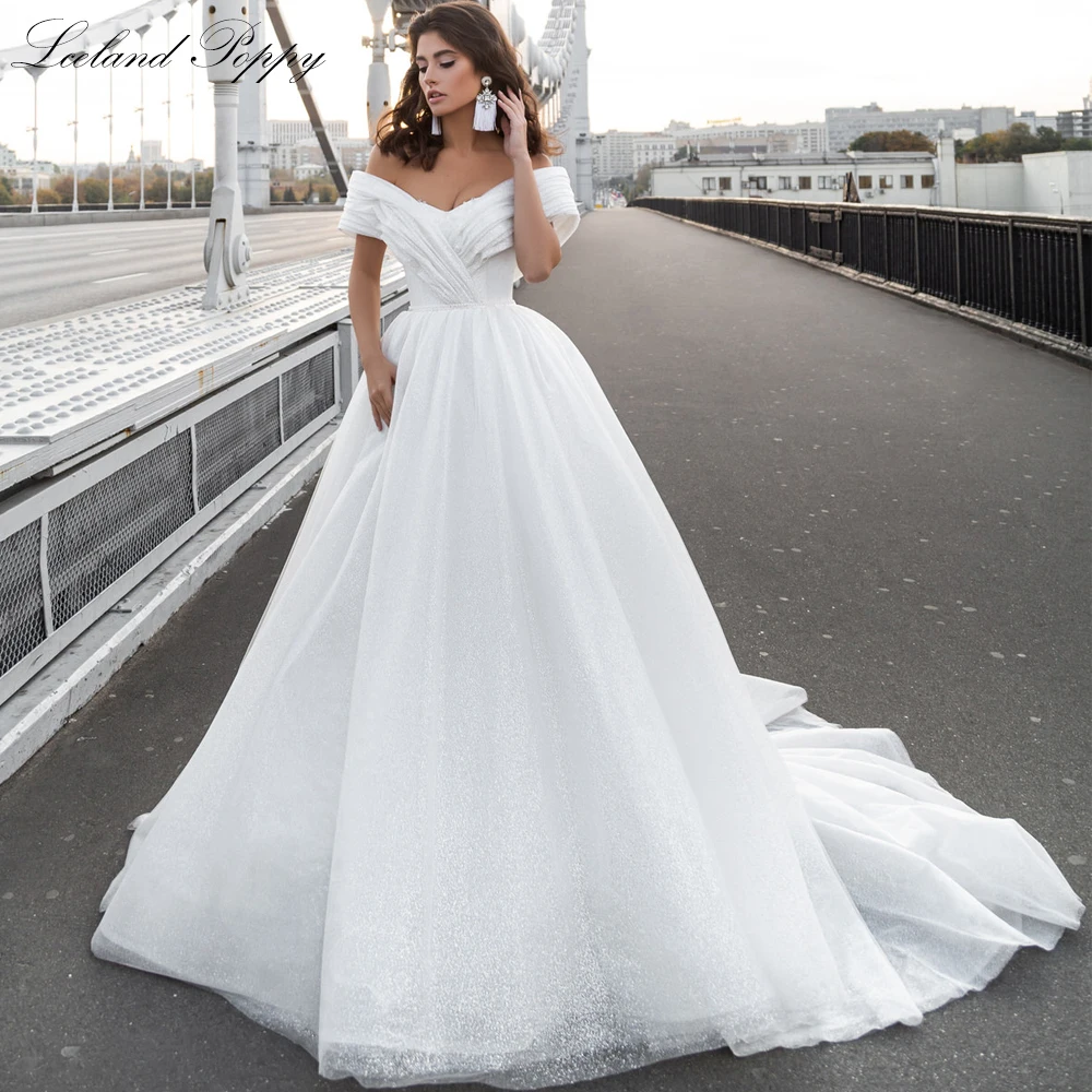 Lceland Poppy A Line Shiny Tulle Wedding Dresses 2021 Off the Shoulder V Neck Floor Length Bridal Gowns Vestido de Noiva
Lceland Poppy A Line Shiny Tulle Wedding Dresses 2021 Off the Shoulder V Neck Floor Length Bridal Gowns Vestido de Noiva