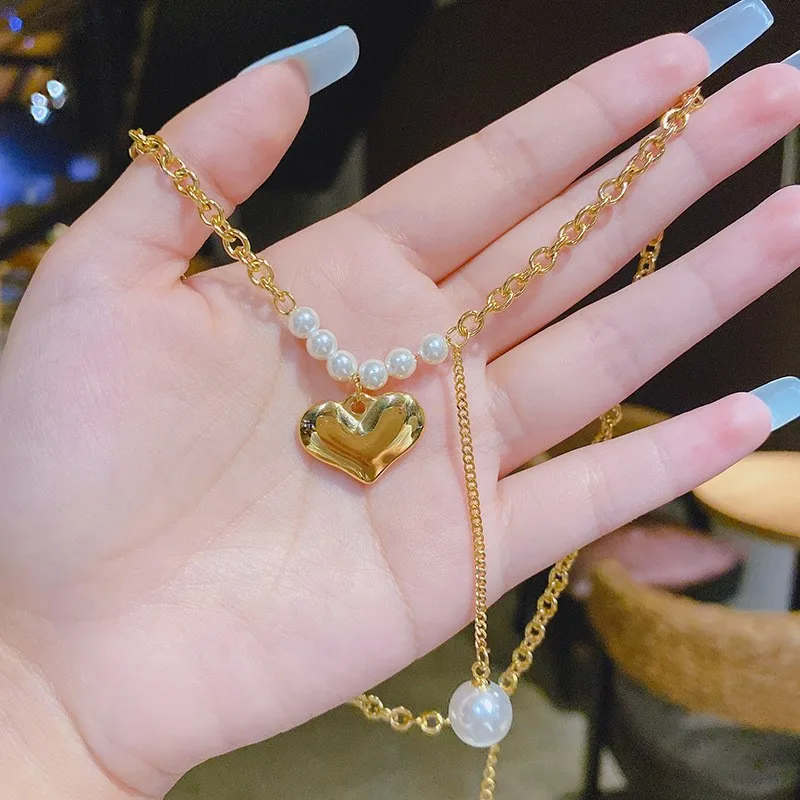 New Korean Version of The Necklace Female Design Sense Pearl Love Pendant Creative Clavicle Chain Girlfriend Gift Necklace
New Korean Version of The Necklace Female Design Sense Pearl Love Pendant Creative Clavicle Chain Girlfriend Gift Necklace