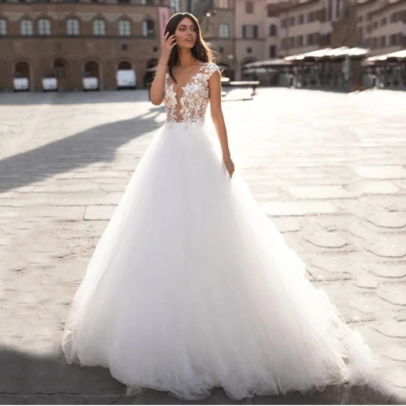 New Appliques Wedding Dresses Beaded A-Line Tulle Gowns Bridal Dresses Illusion O-Neck Sexy vestidos de novia
New Appliques Wedding Dresses Beaded A-Line Tulle Gowns Bridal Dresses Illusion O-Neck Sexy vestidos de novia