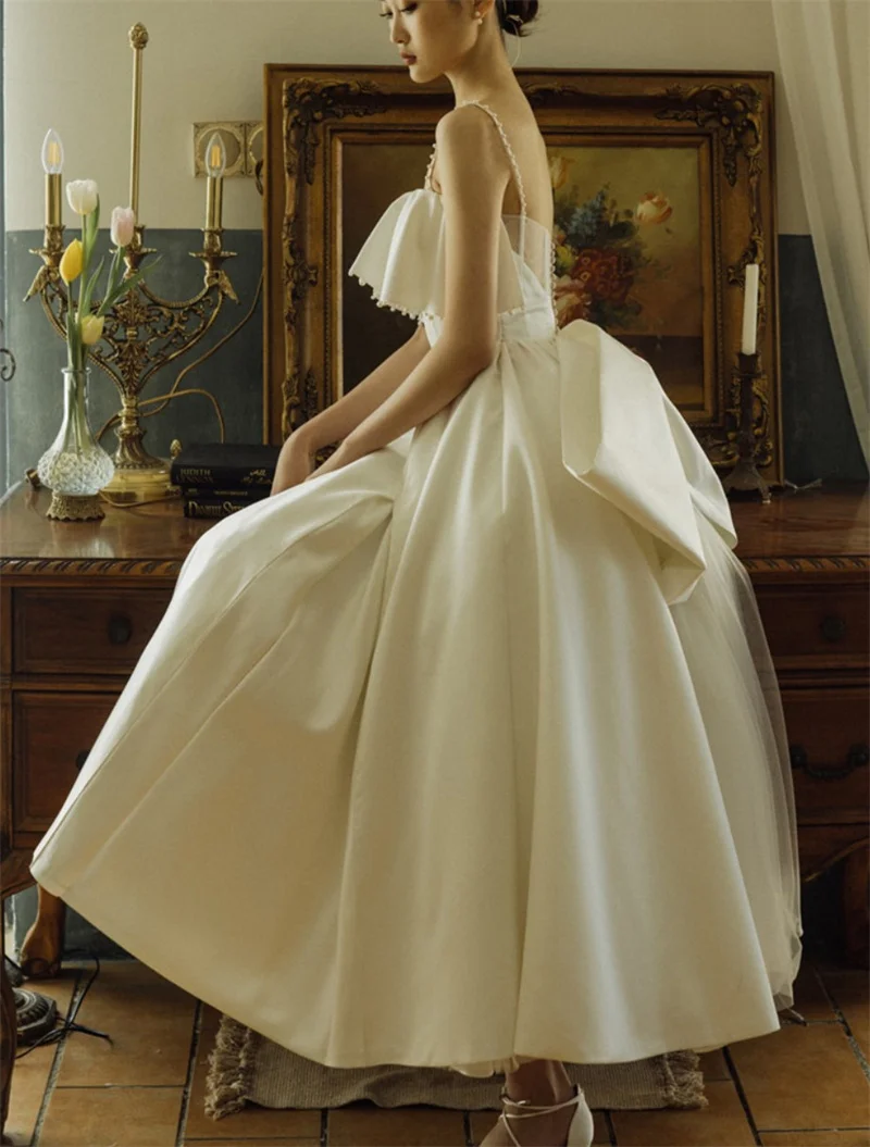 Elegant Spaghetti Strap Pearls Wedding Dress Sleeveless Boning Ankle Length Short Wedding Gown Satin Bow Bride robe de mariée
Elegant Spaghetti Strap Pearls Wedding Dress Sleeveless Boning Ankle Length Short Wedding Gown Satin Bow Bride robe de mariée