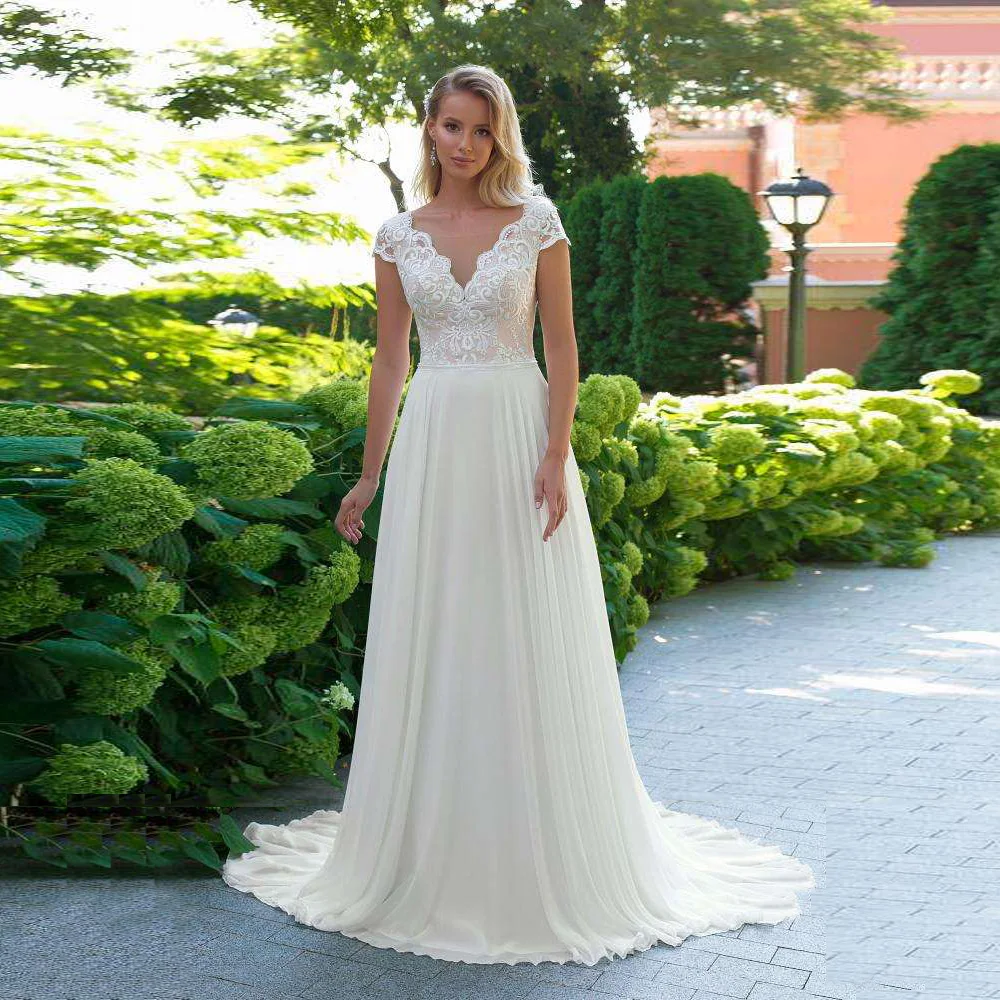Elegant Bohemian Wedding Dress V Neck Cap Sleeve Lace Applique Backless Chiffon Beach Bridal Dresses Vestido De Noiva
Elegant Bohemian Wedding Dress V Neck Cap Sleeve Lace Applique Backless Chiffon Beach Bridal Dresses Vestido De Noiva