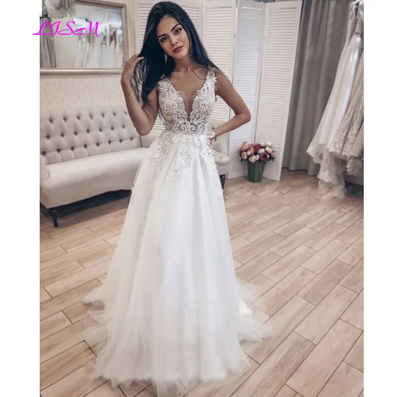 Charming A-Line Beach Wedding Dresses V-Neck Backless Lace Appliques Boho Bridal Gowns Sleeveless Wedding Bridal Dress
Charming A-Line Beach Wedding Dresses V-Neck Backless Lace Appliques Boho Bridal Gowns Sleeveless Wedding Bridal Dress