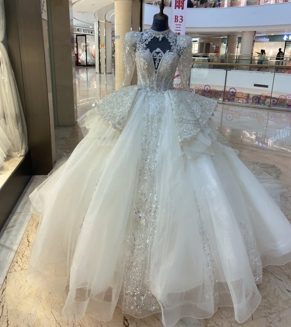 11640 # высококачественное роскошное бальное платье с глубоким круглым вырезом и длинным рукавом с королевским шлейфом, кружевной аппликацией и бисером, свадебное платье
11640 # высококачественное роскошное бальное платье с глубоким круглым вырезом и длинным рукавом с королевским шлейфом, кружевной аппликацией и бисером, свадебное платье