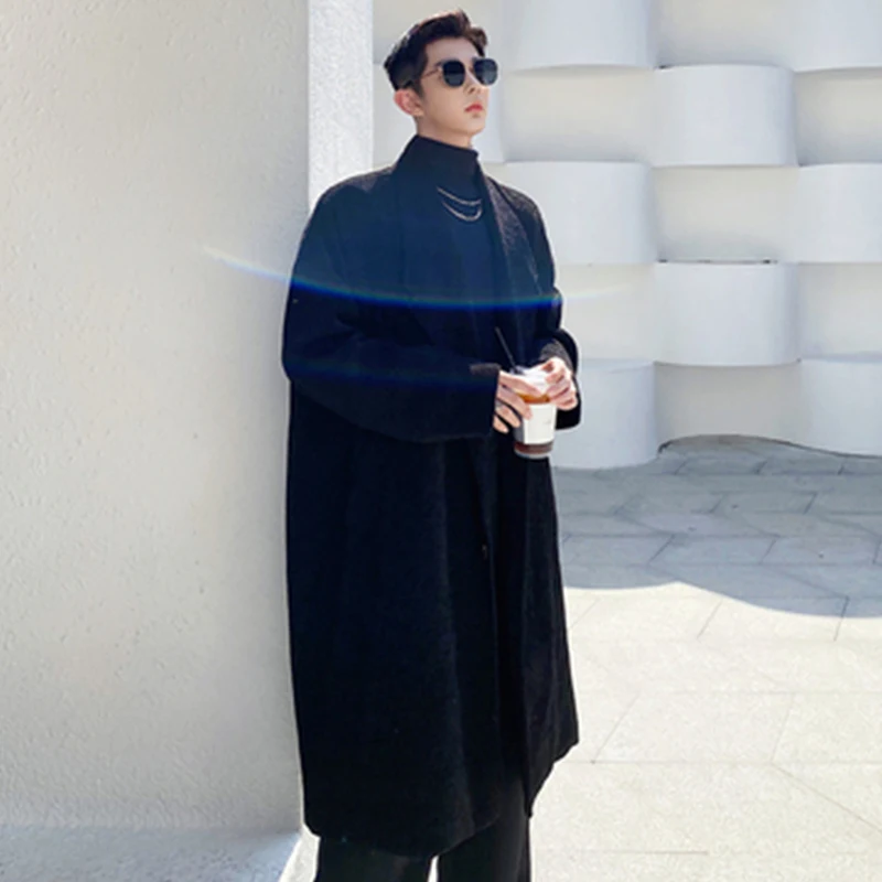 The new winter trend is a minimalist, pure black wool coat. Men's loose, retro, thickened suiting trench coat
The new winter trend is a minimalist, pure black wool coat. Men's loose, retro, thickened suiting trench coat