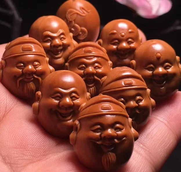 The latest Chinese nuclear color carved Maitreya god of wealth hand string 
The latest Chinese nuclear color carved Maitreya god of wealth hand string