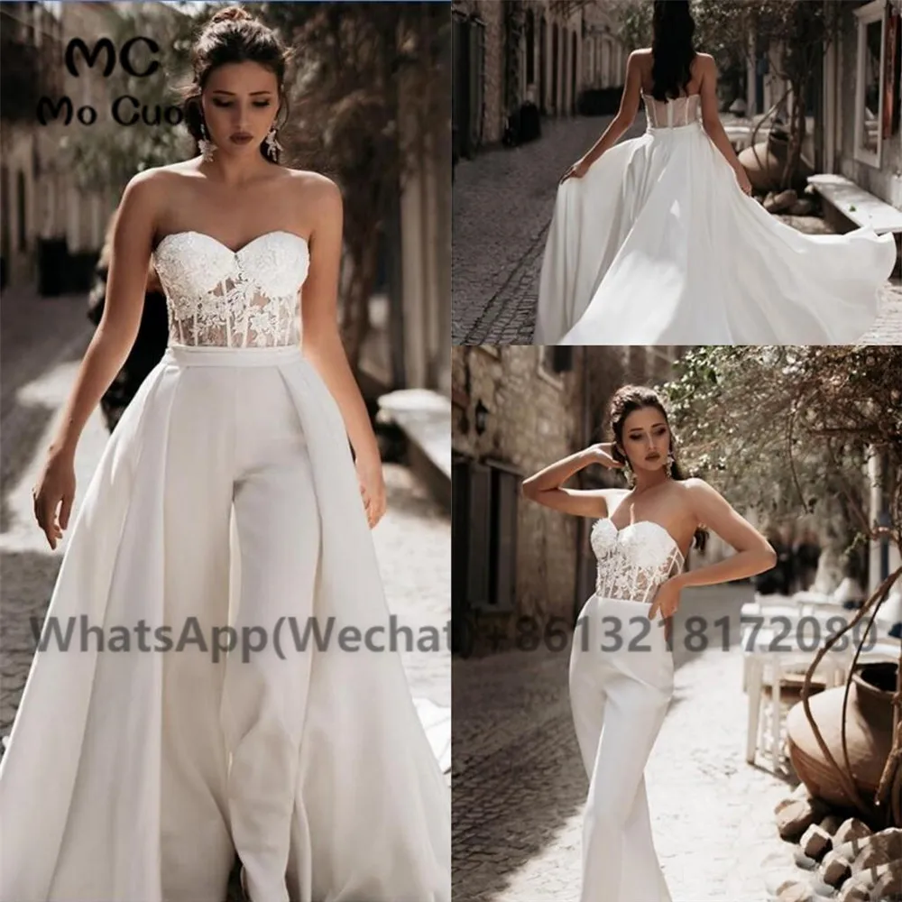 2023 Bohemian Jumpsuit Lace Wedding Dresses Pant Detachable Train Sweetheart Bridal Gowns Satin Boho vestido de novi
2023 Bohemian Jumpsuit Lace Wedding Dresses Pant Detachable Train Sweetheart Bridal Gowns Satin Boho vestido de novi
