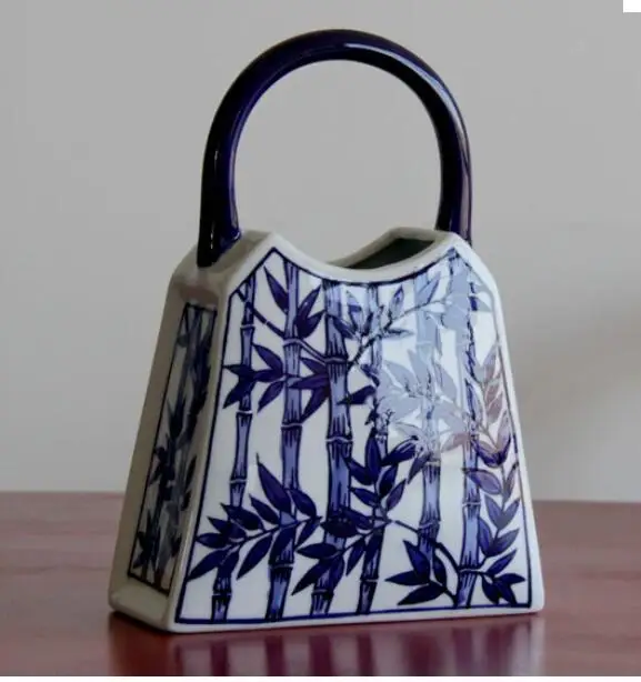 CHINESE-STYLE BLUE AND WHITE CERAMIC HANDBAG SHAPE VASE PORCELAIN VASES FOR ARTIFICIAL FLOWER DECORATION VASES
CHINESE-STYLE BLUE AND WHITE CERAMIC HANDBAG SHAPE VASE PORCELAIN VASES FOR ARTIFICIAL FLOWER DECORATION VASES