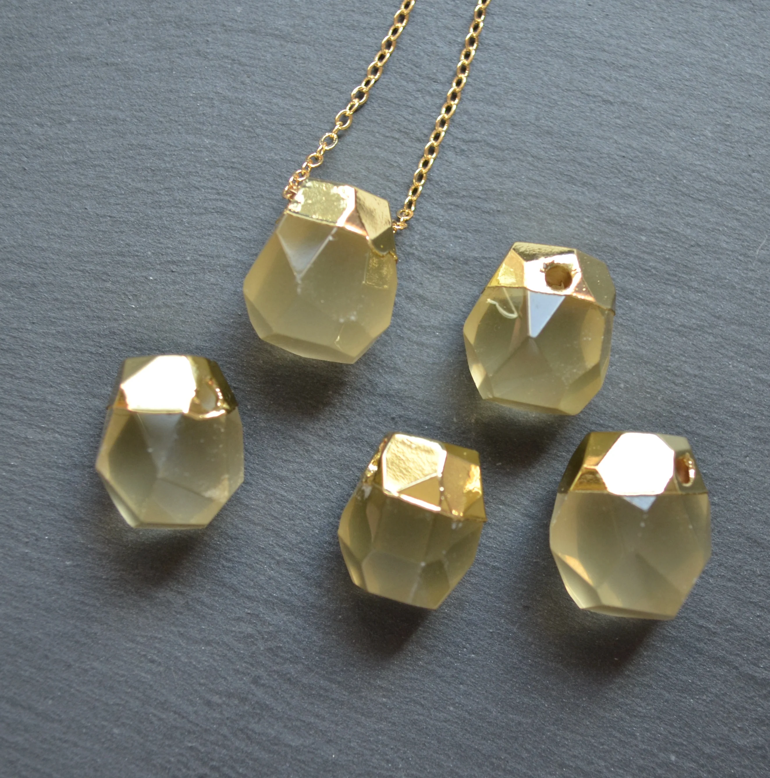 Yellow crystal agates pendants with gold electroplated ,yellow quartz charms
Yellow crystal agates pendants with gold electroplated ,yellow quartz charms