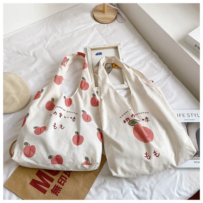 Fashion Canvas Large Capacity Tote Bag Cute Designer Shoulder Bag Japanese Style Peach Print Eco Shopper Bag Handbags for Women
Fashion Canvas Large Capacity Tote Bag Cute Designer Shoulder Bag Japanese Style Peach Print Eco Shopper Bag Handbags for Women