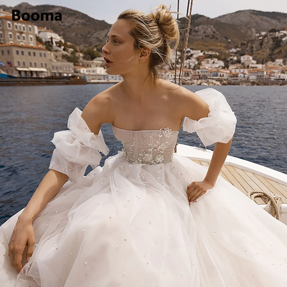 Booma Strapless Pearls Tulle Beach Wedding Dresses with Detachable Sleeves Lace Appliques Corset A-Line Princess Bridal Gowns
Booma Strapless Pearls Tulle Beach Wedding Dresses with Detachable Sleeves Lace Appliques Corset A-Line Princess Bridal Gowns