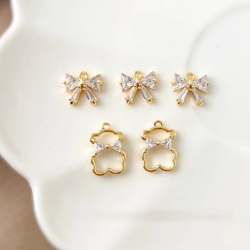 18K gold-clad cute and simple wind is small and exquisite with zircon bow bear pendant DIY earring necklace material
18K gold-clad cute and simple wind is small and exquisite with zircon bow bear pendant DIY earring necklace material