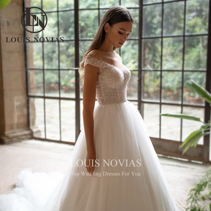 LOUIS NOVIAS Off the Shoulder Wedding Dresses For Women Sexy Luxury Sweetheart Bride Sashes A-Line Bridal Gown Vestidos De Novia 
LOUIS NOVIAS Off the Shoulder Wedding Dresses For Women Sexy Luxury Sweetheart Bride Sashes A-Line Bridal Gown Vestidos De Novia