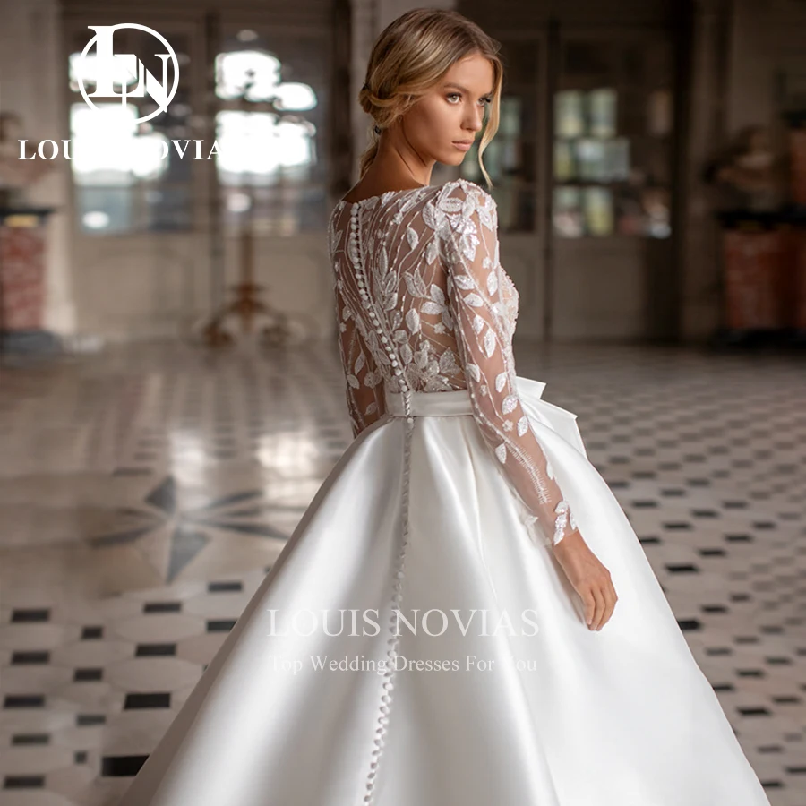 LOUIS NOVIAS Атласное свадебное платье с длинным рукавом и бантом, полупрозрачное бальное платье с овальным вырезом, свадебное платье принцессы Vestidos De Novia
LOUIS NOVIAS Атласное свадебное платье с длинным рукавом и бантом, полупрозрачное бальное платье с овальным вырезом, свадебное платье принцессы Vestidos De Novia