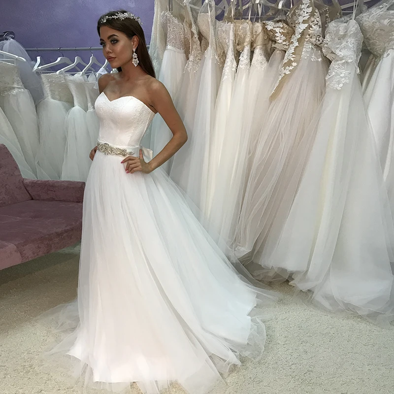 Elegant Lace Sweetheart Sleeveless Beading Belt Tulle Wedding Dress Simple Bridal Dress vestido de fiesta de boda
Elegant Lace Sweetheart Sleeveless Beading Belt Tulle Wedding Dress Simple Bridal Dress vestido de fiesta de boda