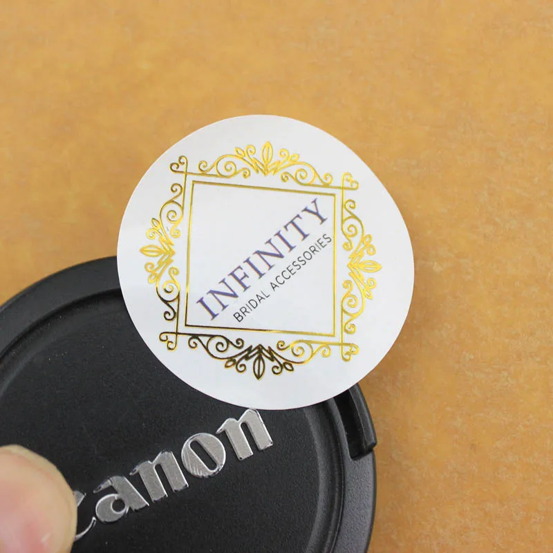 Custom Logo Printing Clear Gold Foil Stamping Labels Waterproof Self Adhesive Transparent Vinyl Stickers in Roll or Sheet
Custom Logo Printing Clear Gold Foil Stamping Labels Waterproof Self Adhesive Transparent Vinyl Stickers in Roll or Sheet