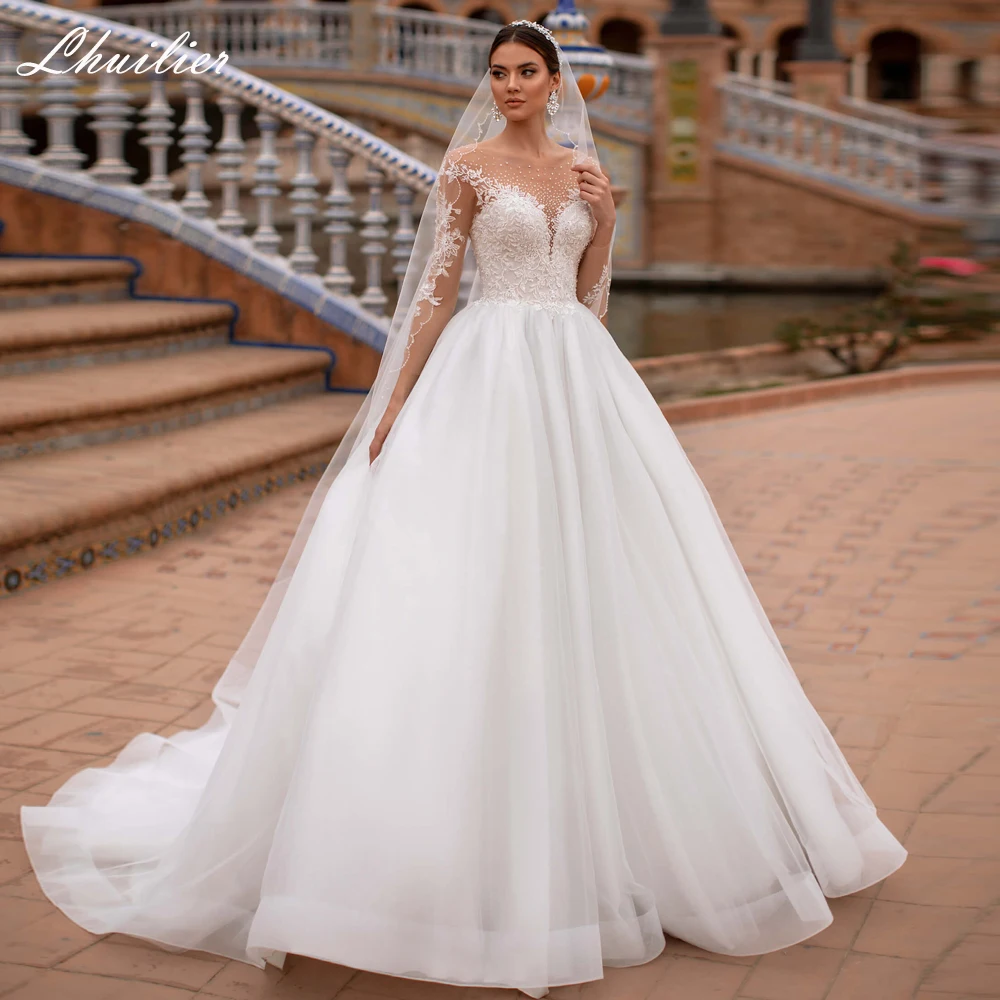 Lhuilier Customized Scoop Neck A-line Tulle Wedding Dresses Beaded Full Sleeves Floor Length Bridal Dress with Court Train
Lhuilier Customized Scoop Neck A-line Tulle Wedding Dresses Beaded Full Sleeves Floor Length Bridal Dress with Court Train