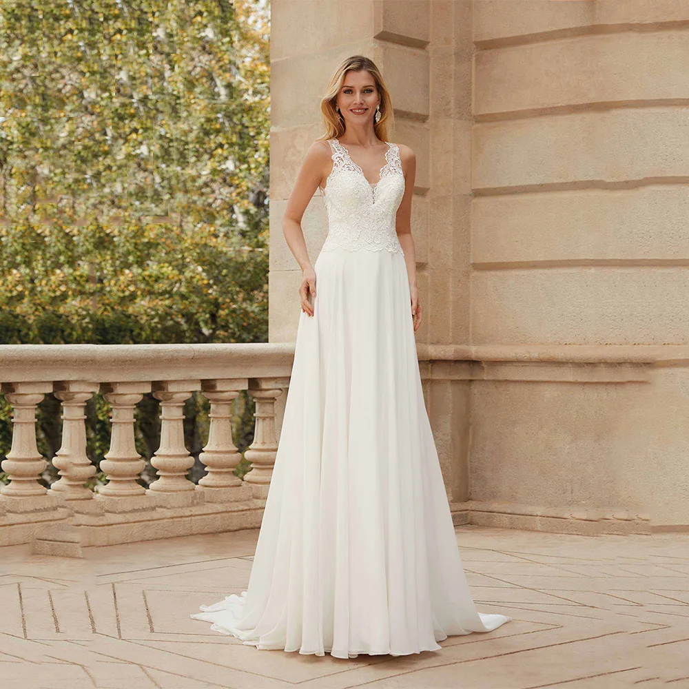 2021 Summer Beach Wedding Dress V Neck Sleeveless Lace Applique A Line Sweep Train Backless Sexy Chiffon Bridal Gowns
2021 Summer Beach Wedding Dress V Neck Sleeveless Lace Applique A Line Sweep Train Backless Sexy Chiffon Bridal Gowns