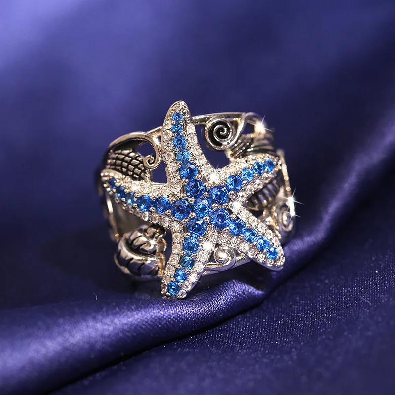 Exquisite Silver Plated Hollow Starfish Ring White Blue Zircon Crystal Party Ring Bridal Jewelry Women Charming Hip Hop Jewelry
Exquisite Silver Plated Hollow Starfish Ring White Blue Zircon Crystal Party Ring Bridal Jewelry Women Charming Hip Hop Jewelry