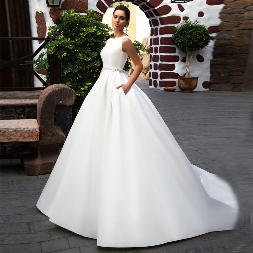Ivory Satin Wedding Dresses Ball Gown with Pockets Sashes Simple Bridal Gowns Backless Boat Neck Princess Dress Plus Size
Ivory Satin Wedding Dresses Ball Gown with Pockets Sashes Simple Bridal Gowns Backless Boat Neck Princess Dress Plus Size