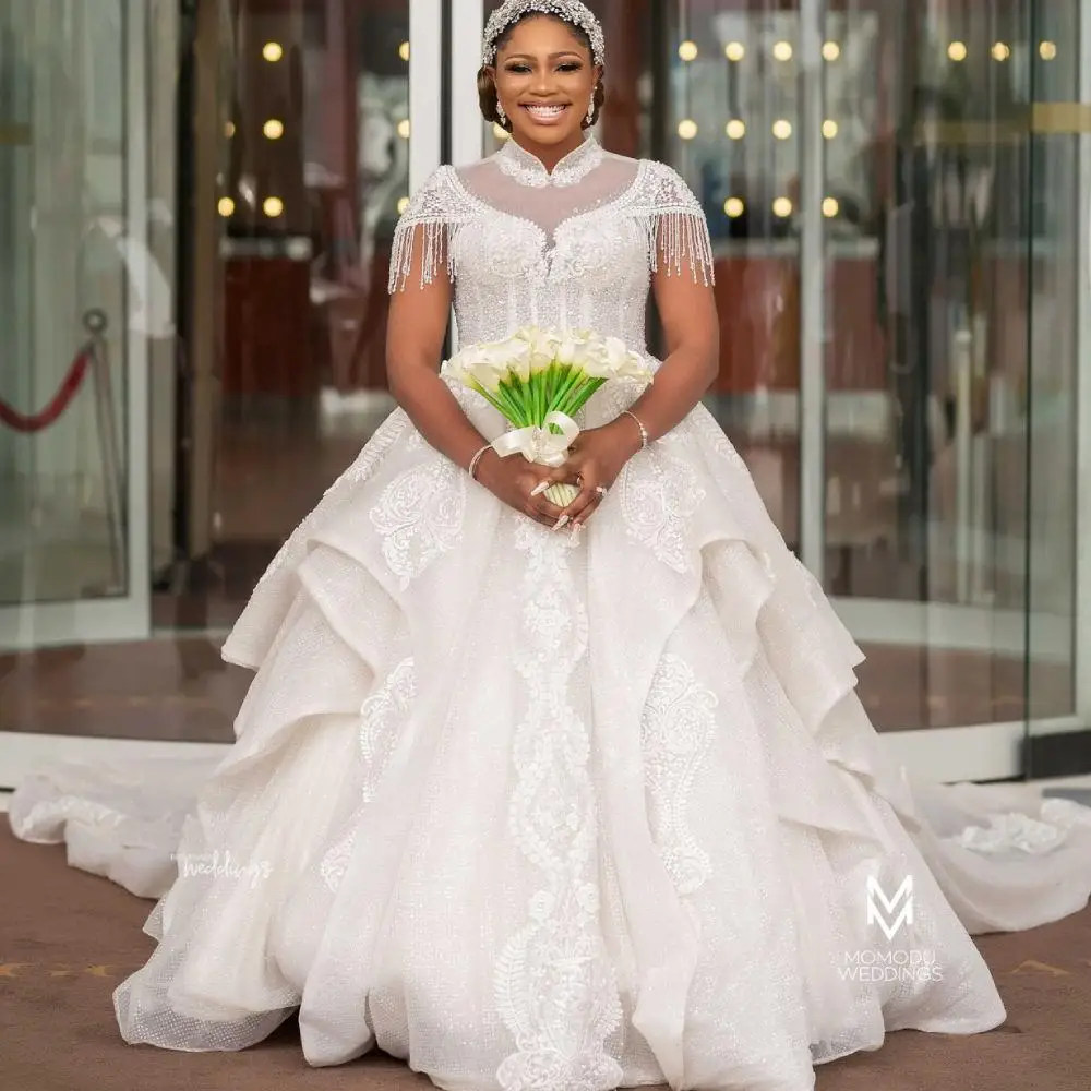 High Neck African Wedding Dresse Short Sleeves Lace Appliqued Beaded Tassel Country Bridal Gowns Plus Size Vestido De Noiva
High Neck African Wedding Dresse Short Sleeves Lace Appliqued Beaded Tassel Country Bridal Gowns Plus Size Vestido De Noiva