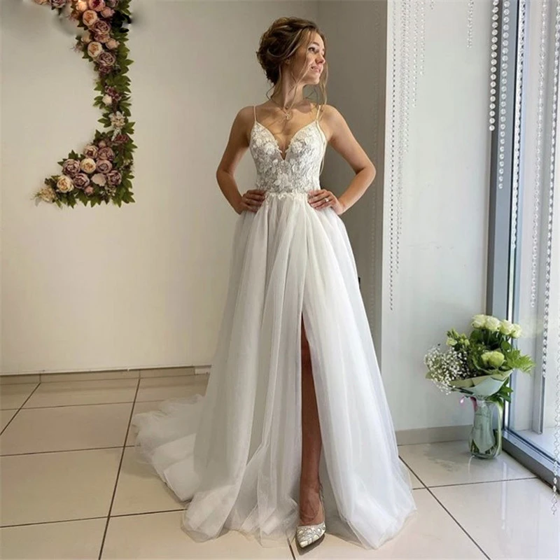 Boho Wedding Dresses with Slit Spaghetti Straps A-Line Appliqued Bride Dress Custom Made High Split Wedding Gown
Boho Wedding Dresses with Slit Spaghetti Straps A-Line Appliqued Bride Dress Custom Made High Split Wedding Gown