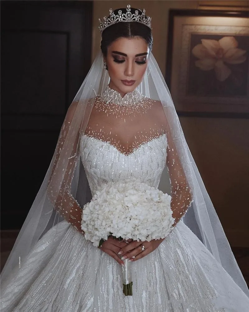 Real Pictures Luxury Applique Sequined Ball Gown Wedding Dresses High Neck Crystal Beaded Saudi Arabic Dubai Bridal Gowns
Real Pictures Luxury Applique Sequined Ball Gown Wedding Dresses High Neck Crystal Beaded Saudi Arabic Dubai Bridal Gowns