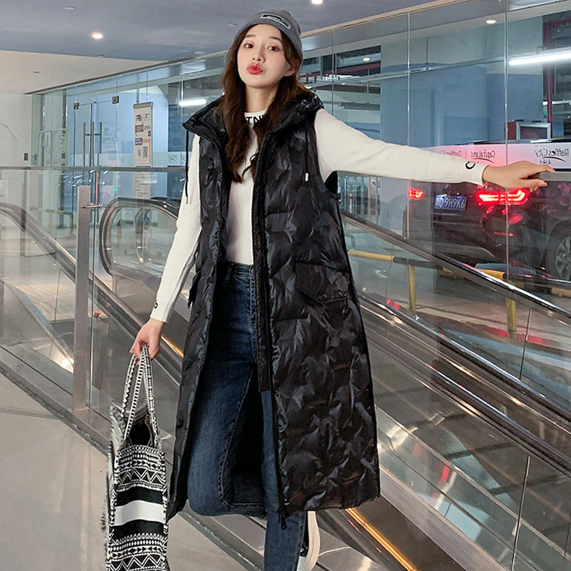 Winter Casual Mid Long Waistcoat for Women Sleevless Warm Hooded Ladies Vest Jacket with Pockets Down Cotton Padded Female Vest
Winter Casual Mid Long Waistcoat for Women Sleevless Warm Hooded Ladies Vest Jacket with Pockets Down Cotton Padded Female Vest