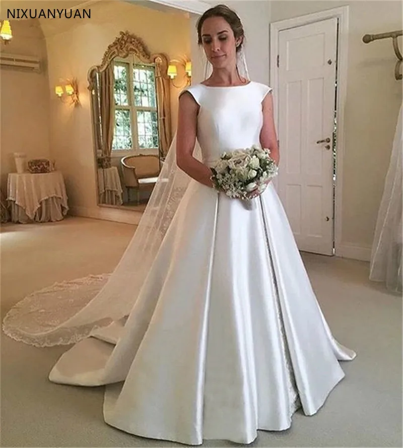 Scoop A-Line Satin Wedding Dresses Hand Made Open Back Ivory Satin Bridal Dresses Court Train Backless Bow Accessory
Scoop A-Line Satin Wedding Dresses Hand Made Open Back Ivory Satin Bridal Dresses Court Train Backless Bow Accessory