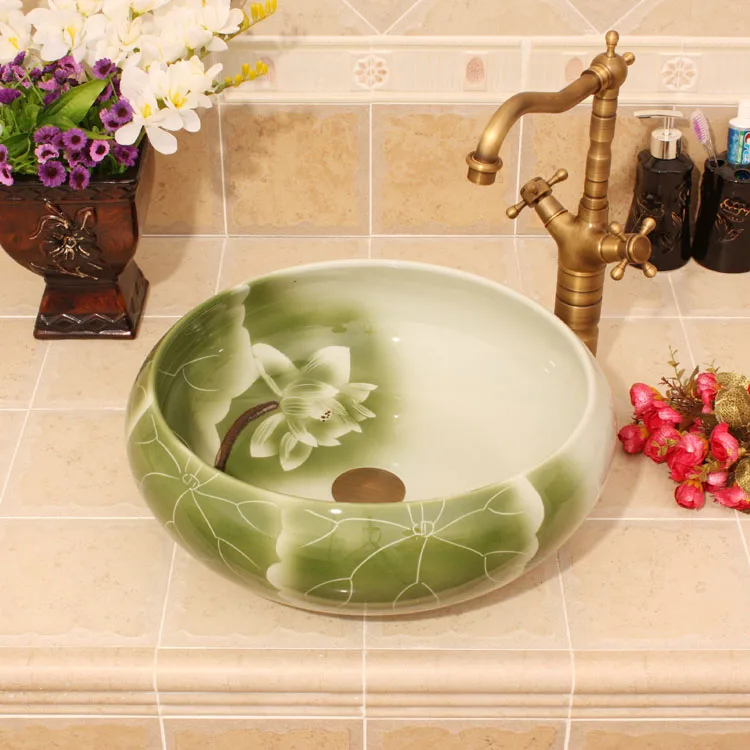 Green Lotus Painting China Artistic Handmade Ceramic Bathroom Sinks Lavobo Round Counter top colored bathroom sink
Green Lotus Painting China Artistic Handmade Ceramic Bathroom Sinks Lavobo Round Counter top colored bathroom sink