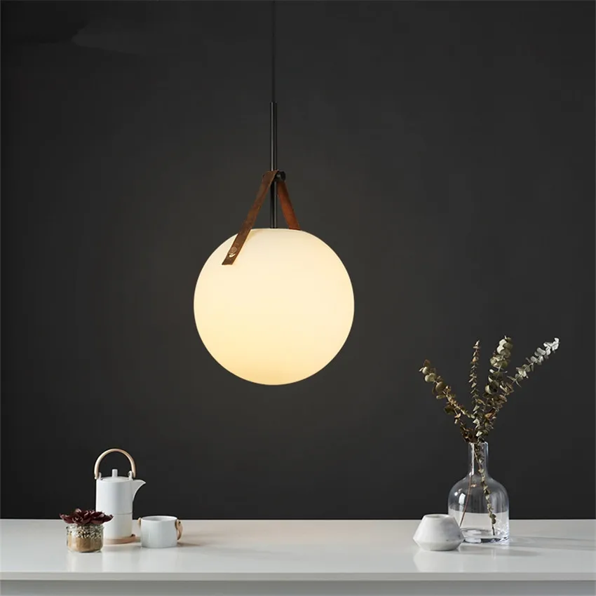 LED Belt Glass Ball Pendant Lights E27 Restaurant Nordic Luxury Bedroom Table Leather Hanging Lamps Coffee Shop Deco Fixtures
LED Belt Glass Ball Pendant Lights E27 Restaurant Nordic Luxury Bedroom Table Leather Hanging Lamps Coffee Shop Deco Fixtures