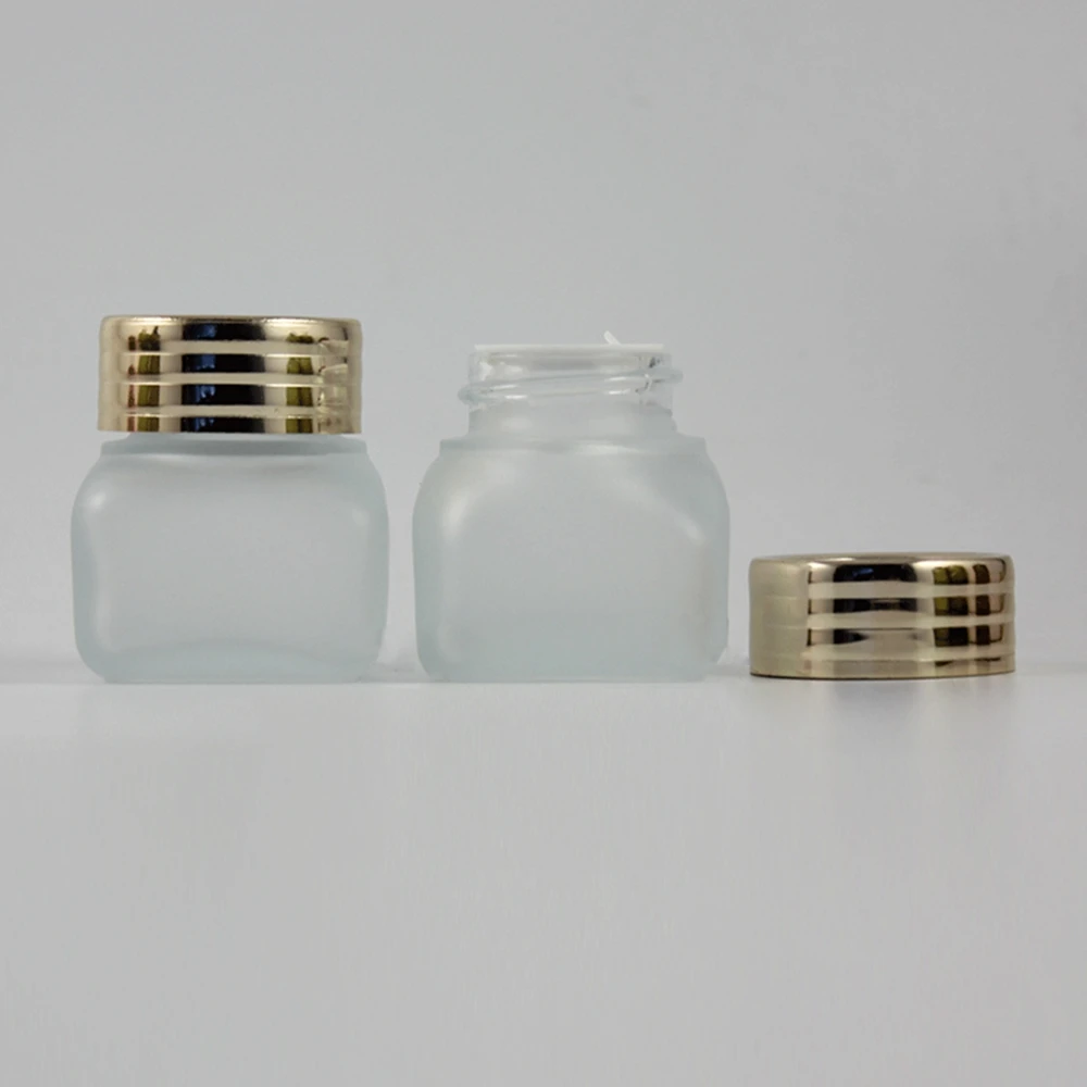 30pce empty unique 15g clear frosted square glass cream jar with shiny gold lid, wholesale glass 15g cosmetic jar for eye cream
30pce empty unique 15g clear frosted square glass cream jar with shiny gold lid, wholesale glass 15g cosmetic jar for eye cream