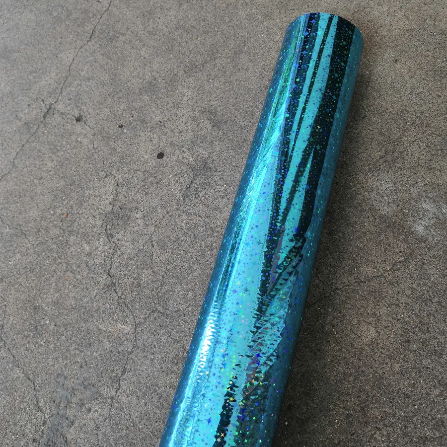 Holographic foil light blue color star pattern hot stamping on paper or plastic 64cm x 120m
Holographic foil light blue color star pattern hot stamping on paper or plastic 64cm x 120m