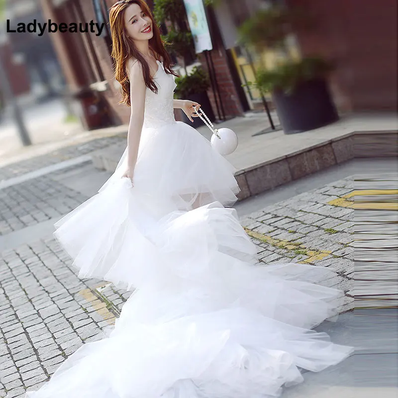 Высококачественное свадебное платье Ladybeauty 2021, свадебные наряды с короткой передней и длинной задней частью, свадебные платья с высокой и низкой аппликацией, свадебные платья
Высококачественное свадебное платье Ladybeauty 2021, свадебные наряды с короткой передней и длинной задней частью, свадебные платья с высокой и низкой аппликацией, свадебные платья