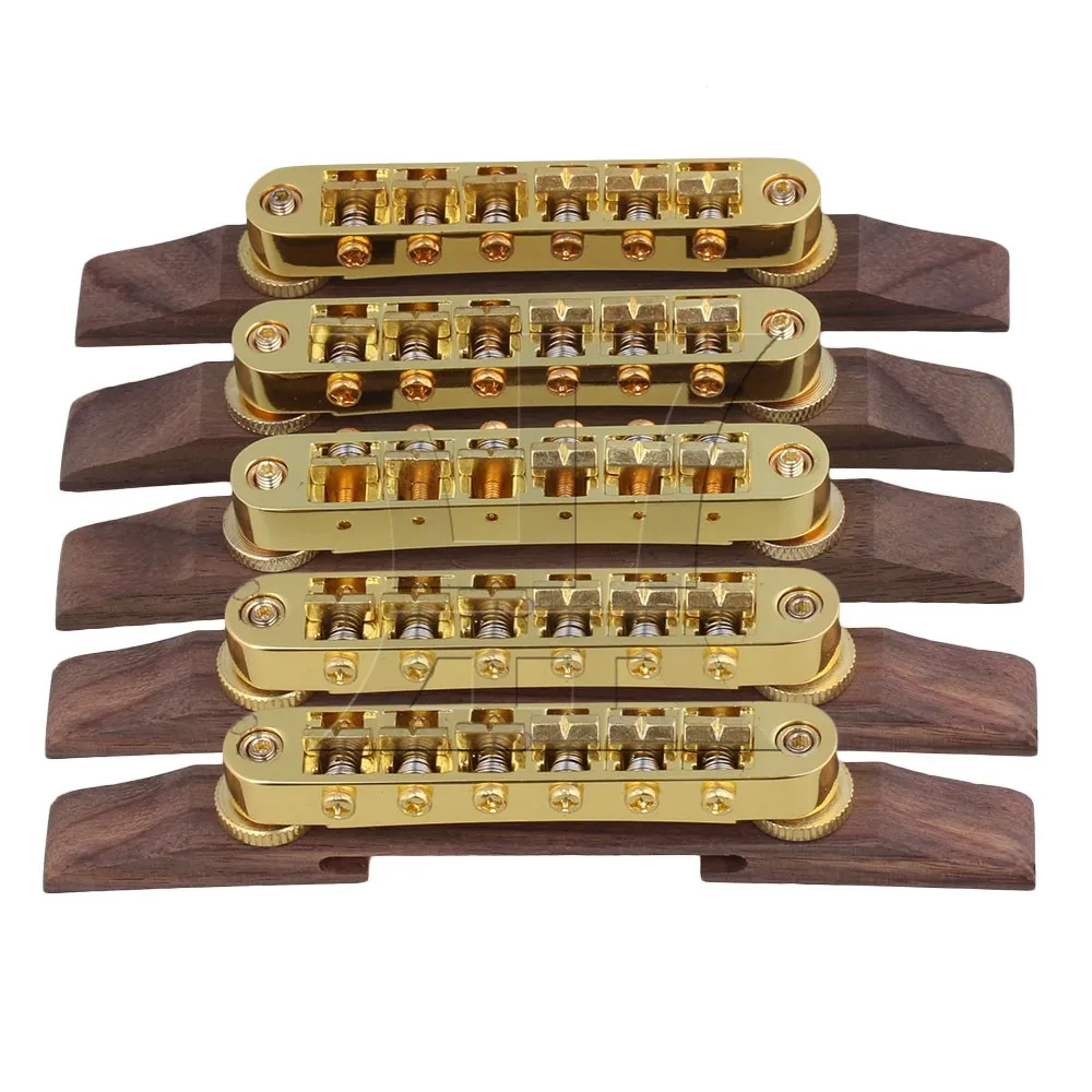 Yibuy Gold Plated Rosewood Based Bridge w/ Fixed Saddles Archtop Jazz Guitar Part
Yibuy Gold Plated Rosewood Based Bridge w/ Fixed Saddles Archtop Jazz Guitar Part