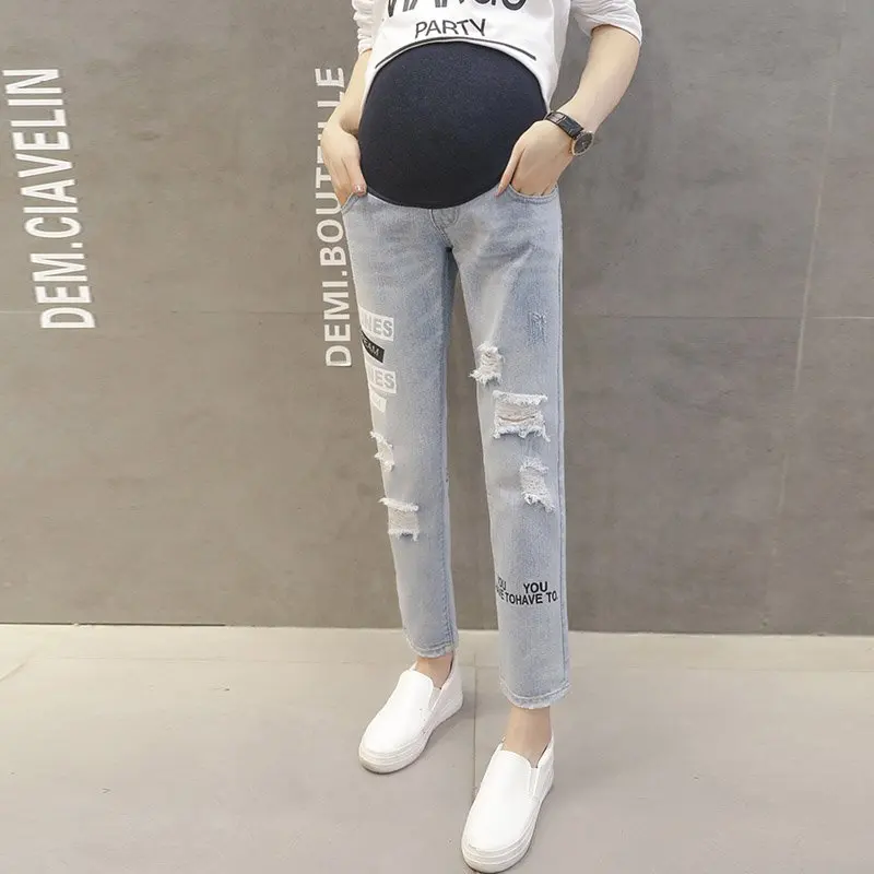 New maternity dress autumn and winter maternity pants pregnant women jeans fashion hole English
New maternity dress autumn and winter maternity pants pregnant women jeans fashion hole English